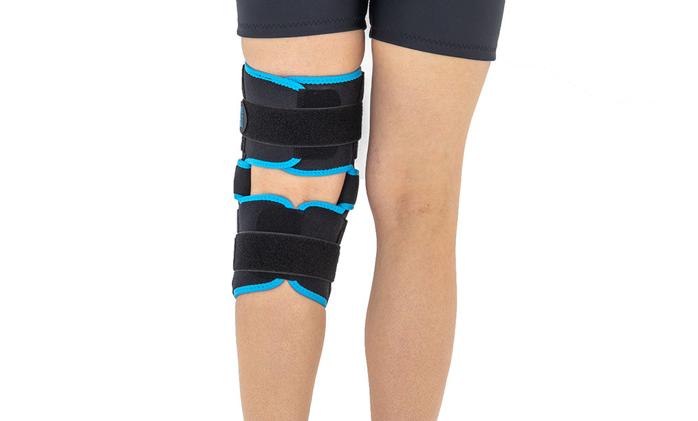 Articulated knee brace with full opening and adjustment
