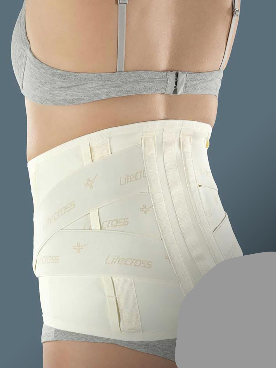 Low elastic orthosis with rigid and thermoformable pads to stabilise the lumbar rachis and relieve pressure