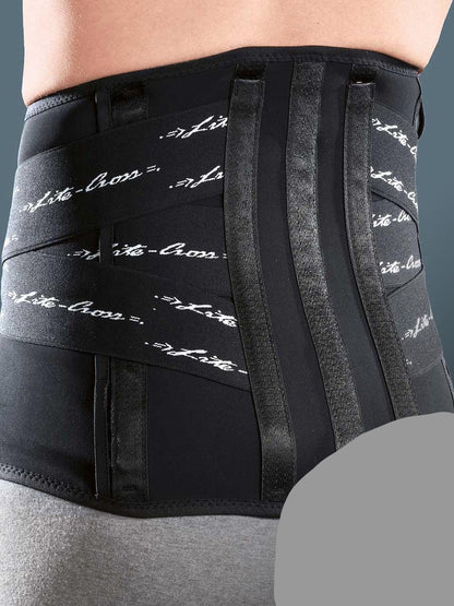 Low elastic orthosis with rigid and thermoformable pads to stabilise the lumbar rachis and relieve pressure