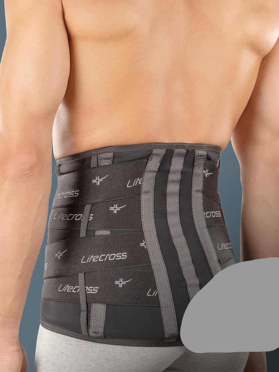 High elastic orthosis with rigid and thermoformable pads to stabilise the lumbar rachis and relieve pressure
