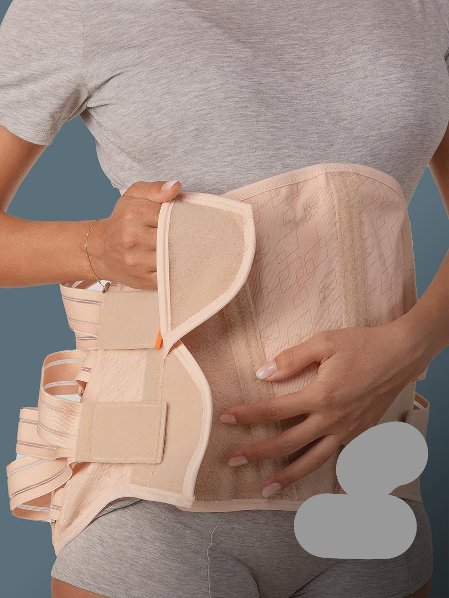 Orthosis for prominent abdomen for stabilising and supporting the lumbar rachis, with rigid and thermoformable pads